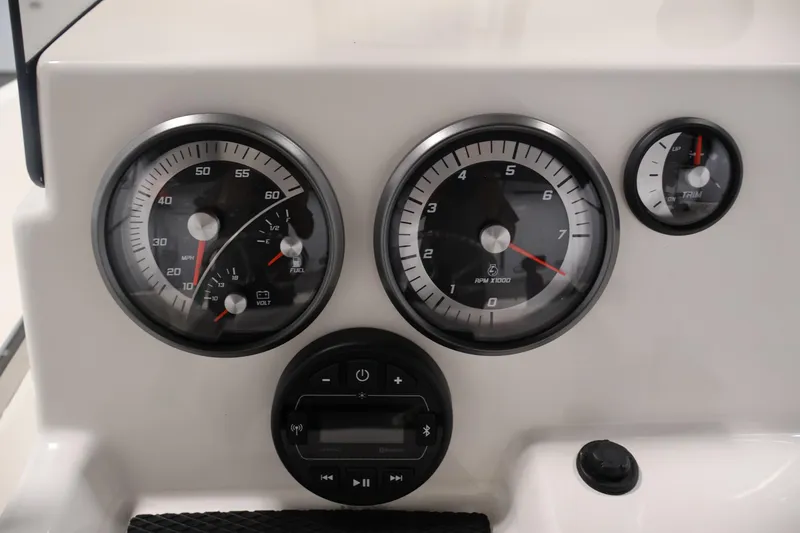 Slide: The Image of Dashboard of 2026 Bayliner Trophy T18 boat with speedometer, tachometer, and trim gauge. - 28