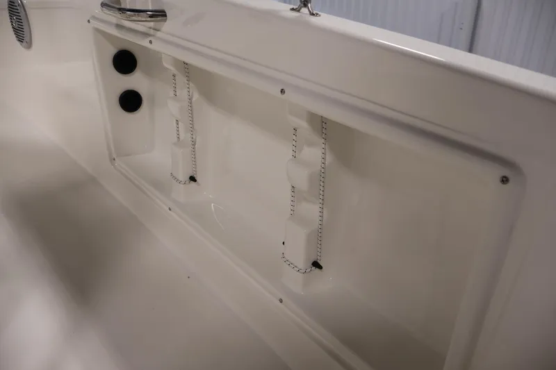 Slide: The Image of 2026 Bayliner Trophy T18 boat interior detail with storage compartment and fixtures. - 33