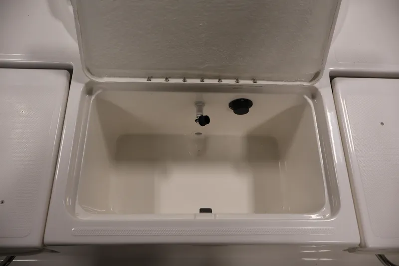 Slide: The Image of Open storage compartment on 2026 Bayliner Trophy T18 boat, showcasing interior space. - 41