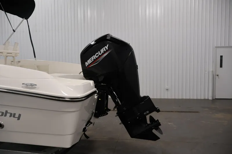 Slide: The Image of 2026 Bayliner Trophy T18 with Mercury outboard motor in a showroom. - 43