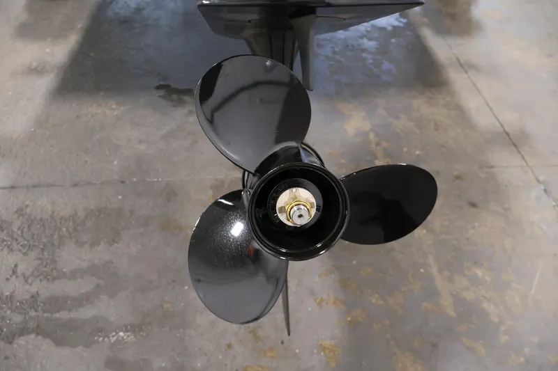 Slide: The Image of Close-up of a 2026 Bayliner Trophy T18 boat propeller on a concrete floor. - 45