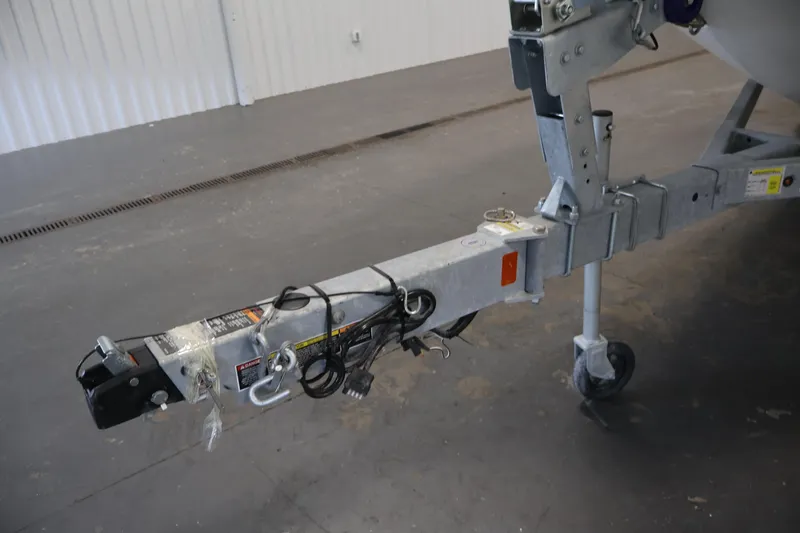 Slide: The Image of Trailer hitch of 2026 Bayliner Trophy T18 boat in a garage setting. - 46