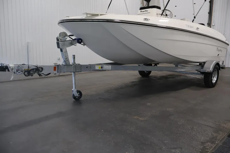 Slide: The Image of 2026 Bayliner Trophy T18 boat on trailer in indoor storage facility. - 47