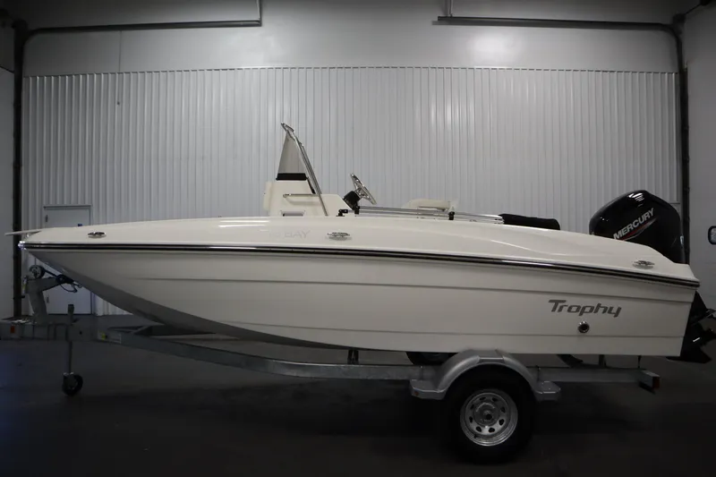Slide: The Image of 2026 Bayliner Trophy T18 boat on trailer in indoor storage facility. - 7