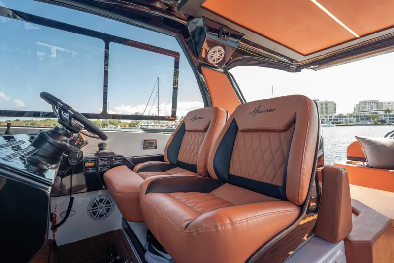 Slide: The Image of Luxurious interior of 2026 Hanover 387 boat with leather seats and modern controls. - 13