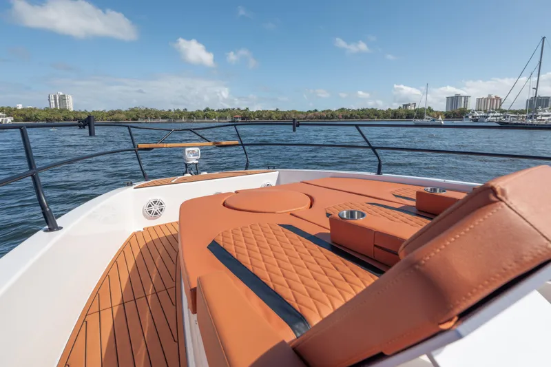 Slide: The Image of Luxurious 2026 Hanover 387 yacht deck with orange seating, cruising on a sunny day. - 32