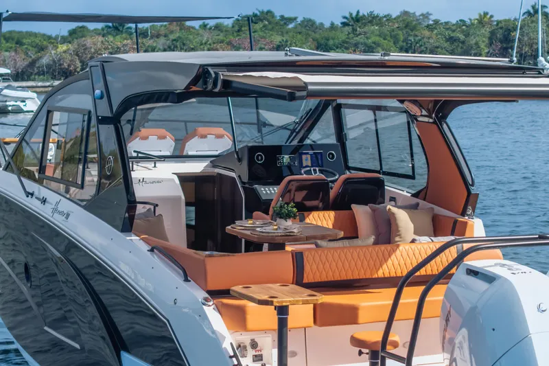Slide: The Image of Luxurious 2026 Hanover 387 yacht with elegant seating and modern amenities on a serene water backdrop. - 40