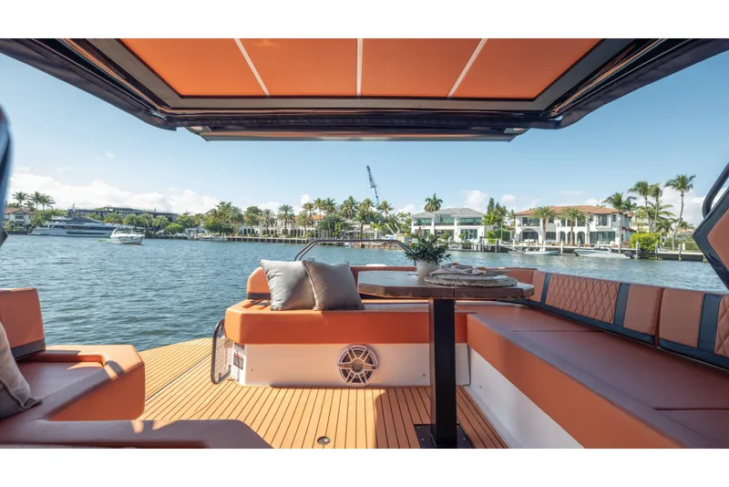 Slide: The Image of Luxurious Hanover 387 yacht interior with waterfront view, featuring elegant seating and table, 2026 model. - 41