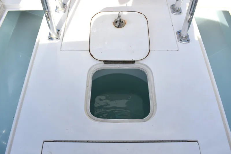 Slide: The Image of Livewell compartment on a 2014 Contender 23 Open boat deck. - 14