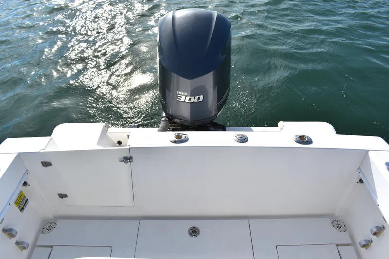 Slide: The Image of 2014 Contender 23 Open boat with Yamaha 300 engine on water. - 15