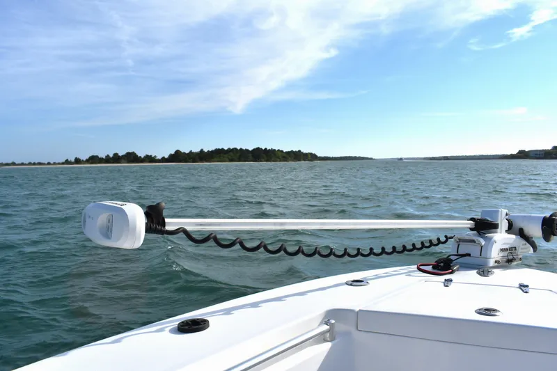 Slide: The Image of 2014 Contender 23 Open boat with trolling motor on open water. - 18