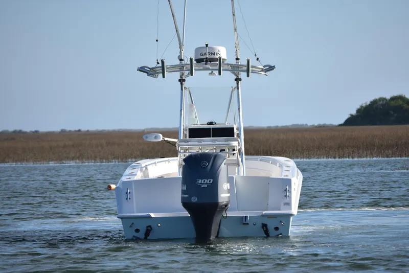 Slide: The Image of 2014 Contender 23 Open boat with Yamaha 300 engine on calm water. - 5