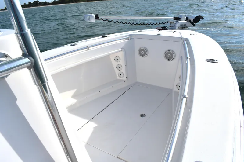Slide: The Image of 2014 Contender 23 Open boat interior with ocean view, featuring sleek white design. - 7