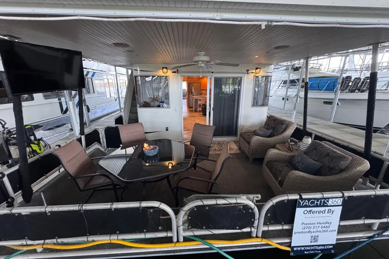 Slide: The Image of Spacious 2004 Starlite 65x16 houseboat with cozy outdoor seating and modern amenities. - 17