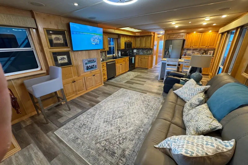 Slide: The Image of Luxurious interior of a 2004 Starlite 65x16 houseboat with modern kitchen and cozy living area. - 27