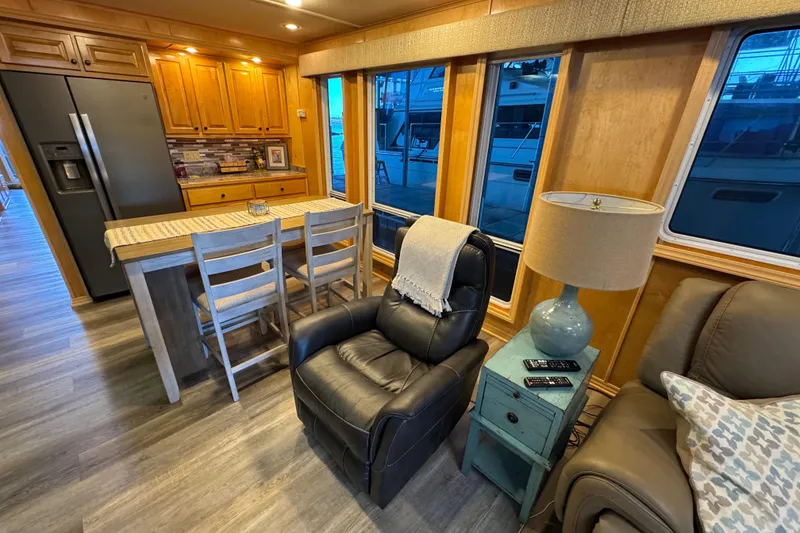 Slide: The Image of Luxurious 2004 Starlite 65x16 houseboat interior with modern kitchen and cozy seating area. - 34