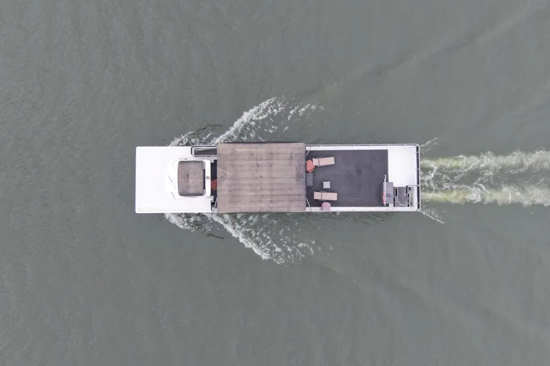 Slide: The Image of Aerial view of Starlite 65x16 boat on water, built in 2004. - 5