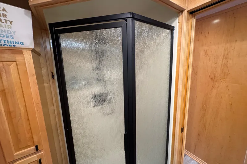Slide: The Image of Shower enclosure in 2004 Starlite 65x16 RV with frosted glass door. - 56