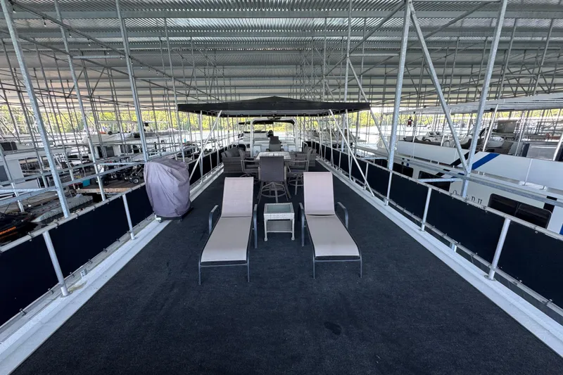 Slide: The Image of Rooftop deck of 2004 Starlite 65x16 houseboat with lounge chairs and seating area. - 84