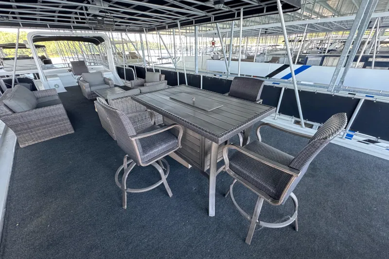 Slide: The Image of Spacious deck on 2004 Starlite 65x16 houseboat with outdoor seating and table. - 85