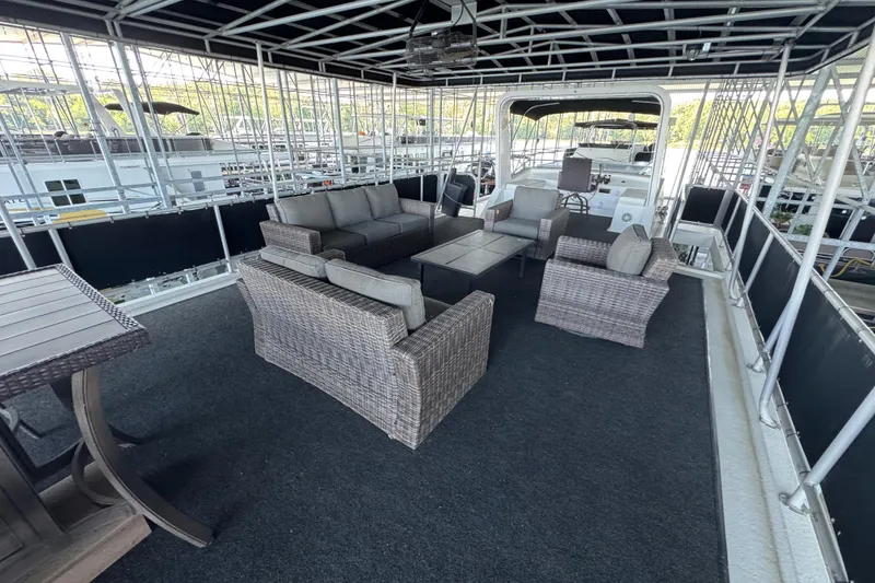 Slide: The Image of Spacious deck of 2004 Starlite 65x16 houseboat with wicker furniture and canopy. - 87