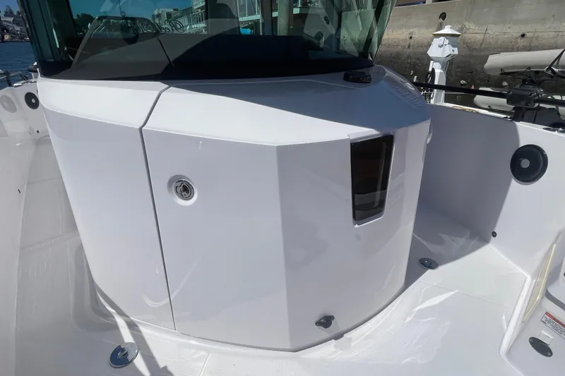 Slide: The Image of 2022 Axopar Brabus 28 Cabin boat exterior, showcasing sleek white design and modern features. - 12