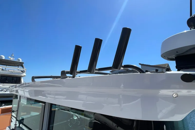 Slide: The Image of 2022 Axopar Brabus 28 Cabin boat roof detail under clear blue sky. - 17
