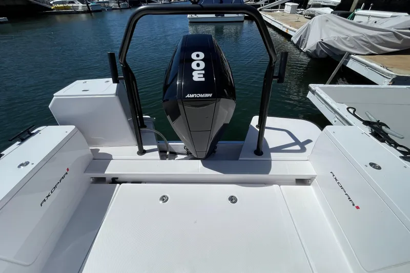 Slide: The Image of 2022 Axopar Brabus 28 Cabin with Mercury 300 engine at marina dock. - 24