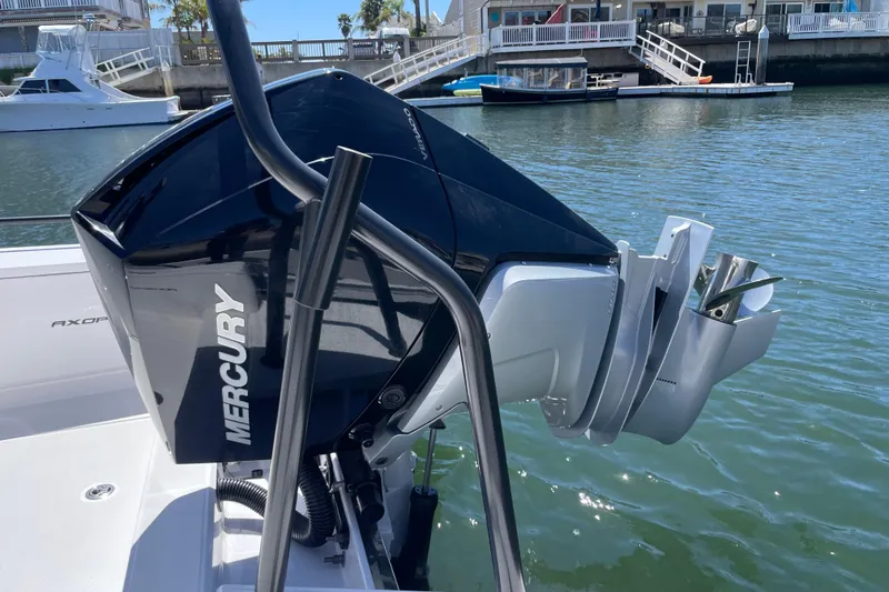 Slide: The Image of 2022 Axopar Brabus 28 Cabin with Mercury outboard engine on water. - 28