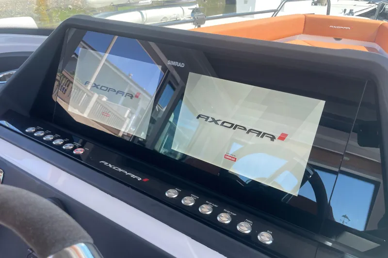 Slide: The Image of Dashboard of 2022 Axopar Brabus 28 Cabin with Simrad display. - 37