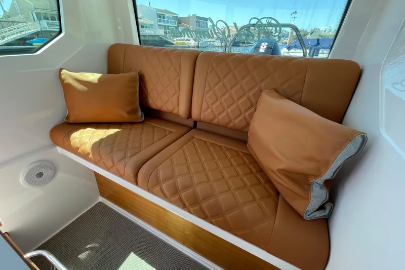 Slide: The Image of Luxurious leather seating in 2022 Axopar Brabus 28 Cabin boat interior. - 44