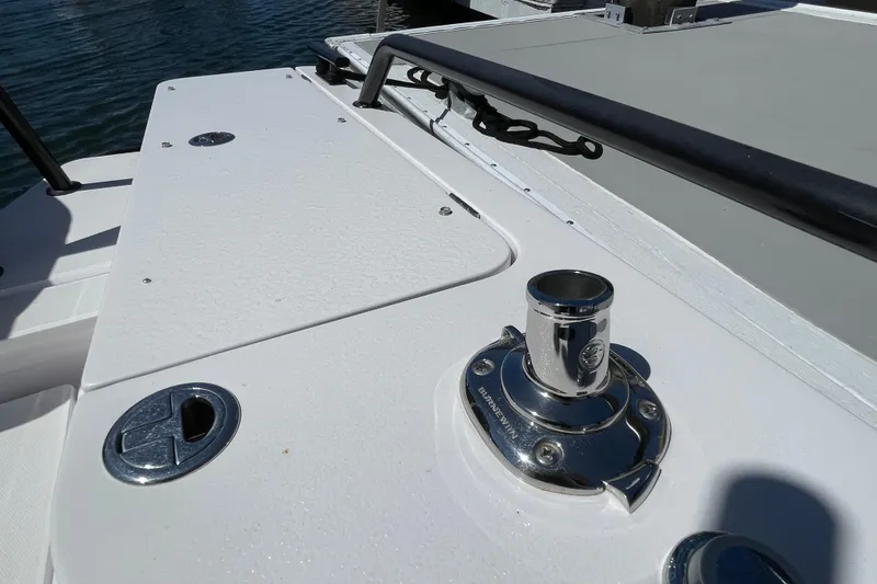 Slide: The Image of 2022 Axopar Brabus 28 Cabin boat deck with chrome fittings and sleek design. - 50