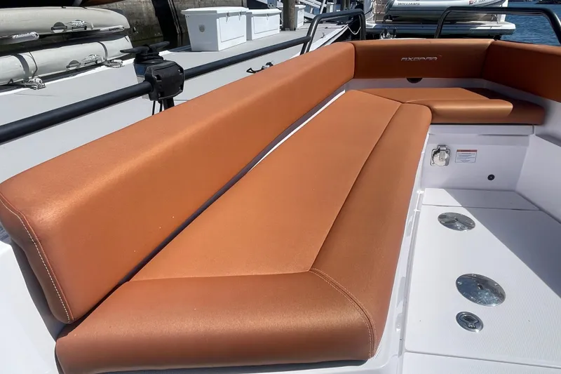 Slide: The Image of Luxurious seating on 2022 Axopar Brabus 28 Cabin boat, featuring sleek design and comfort. - 7