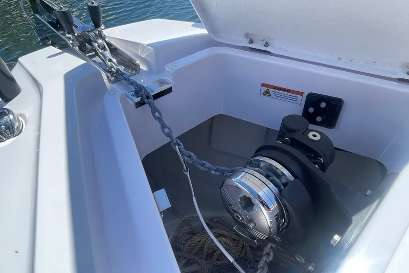 Slide: The Image of Anchor winch system on 2022 Axopar Brabus 28 Cabin boat, featuring chain and rope storage. - 9