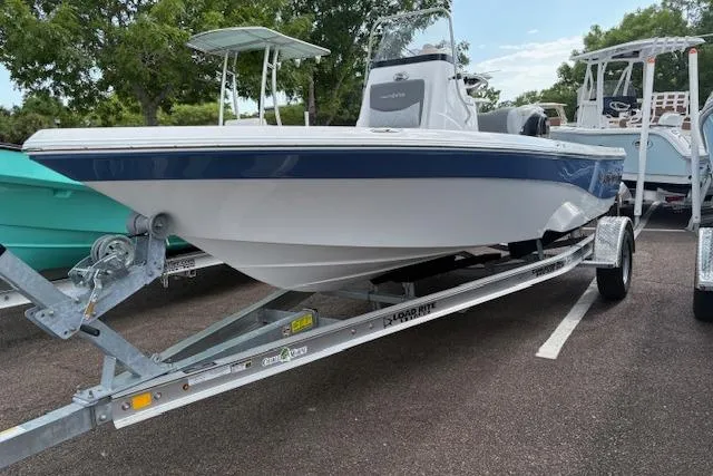 The Image of 2026 NauticStar 194 Bay boat on trailer, parked outdoors. - 0