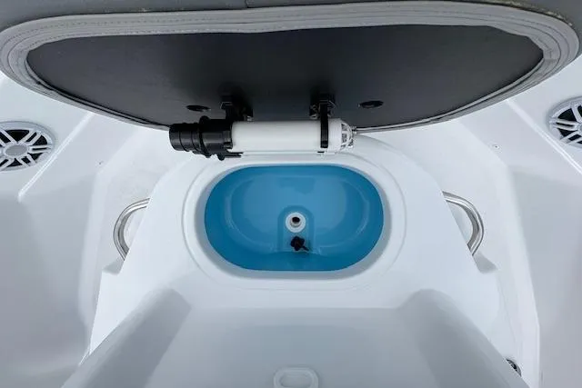 Slide: The Image of 2026 NauticStar 194 Bay boat interior with livewell and speakers. - 15