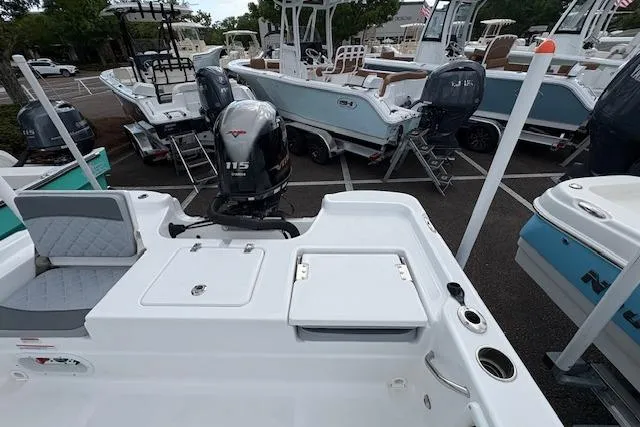 Slide: The Image of 2026 NauticStar 194 Bay boat with Yamaha 115 engine in a marina setting. - 7