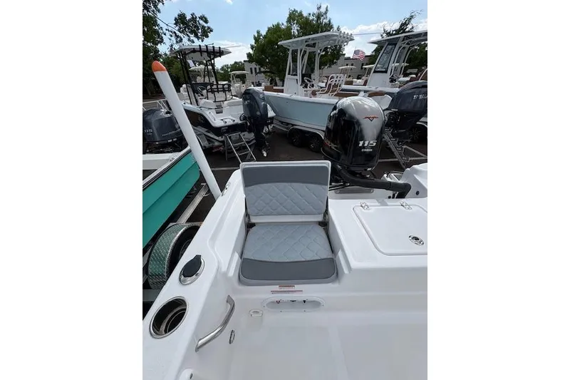 Slide: The Image of 2026 NauticStar 194 Bay boat with Yamaha 115 engine, featuring cushioned seating and sleek design. - 8