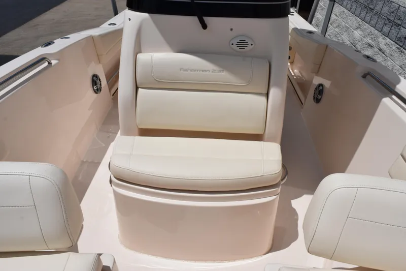 Slide: The Image of 2024 Grady-White Fisherman 236 boat interior with cushioned seating and sleek design. - 12