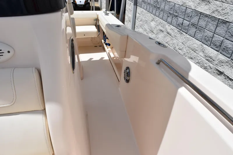 Slide: The Image of 2024 Grady-White Fisherman 236 boat interior with seating and side rail. - 14