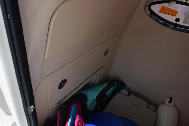 Slide: The Image of Interior storage compartment of 2024 Grady-White Fisherman 236 boat with life jackets. - 17