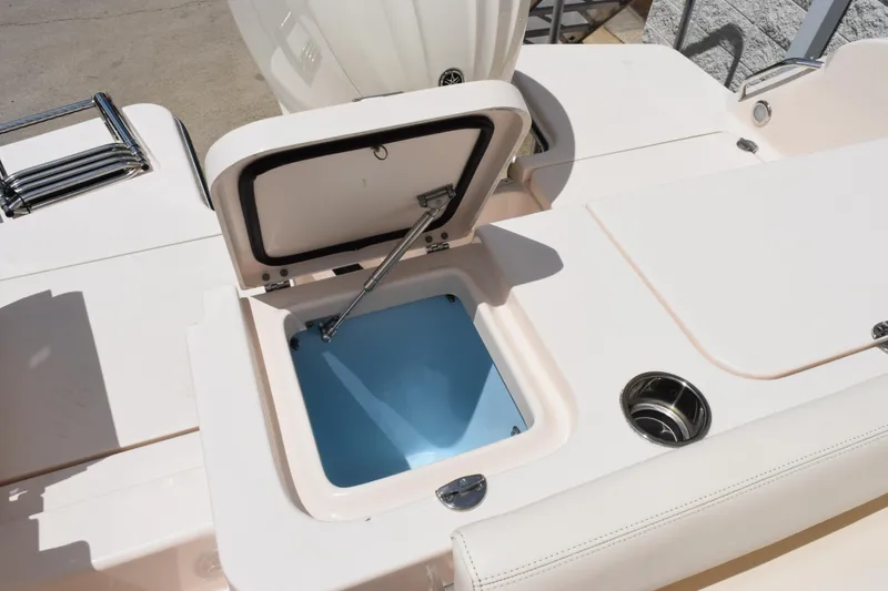 Slide: The Image of 2024 Grady-White Fisherman 236 boat with open storage compartment and cup holder. - 22