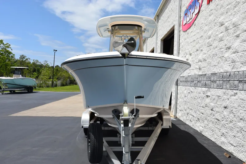 Slide: The Image of 2024 Grady-White Fisherman 236 boat on trailer, parked outside a building. - 3