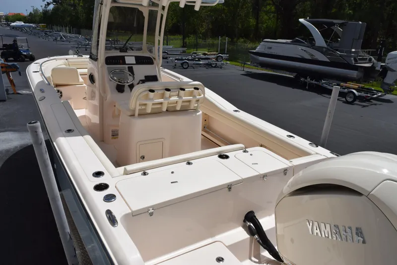 Slide: The Image of 2024 Grady-White Fisherman 236 boat with Yamaha engine, docked outdoors. - 6