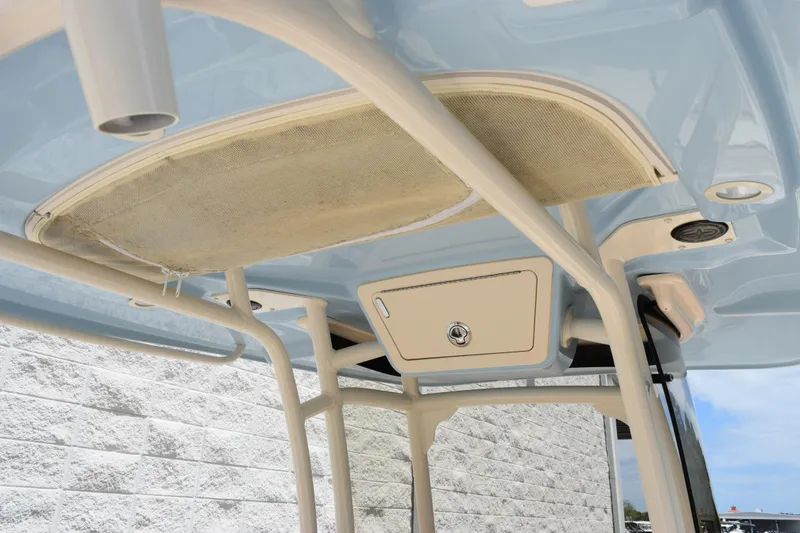 Slide: The Image of 2024 Grady-White Fisherman 236 boat interior, featuring overhead storage and sleek design. - 8