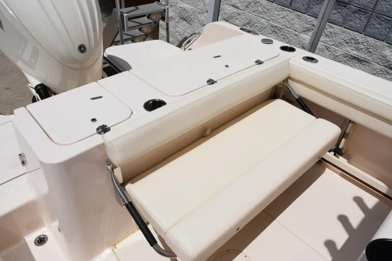 Slide: The Image of 2024 Grady-White Fisherman 236 boat interior with foldable seating and storage compartments. - 9