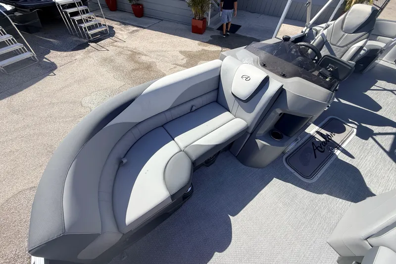 Slide: The Image of 2026 Avalon 2485 LSZ Quad Lounger boat interior with sleek seating and modern helm. - 10