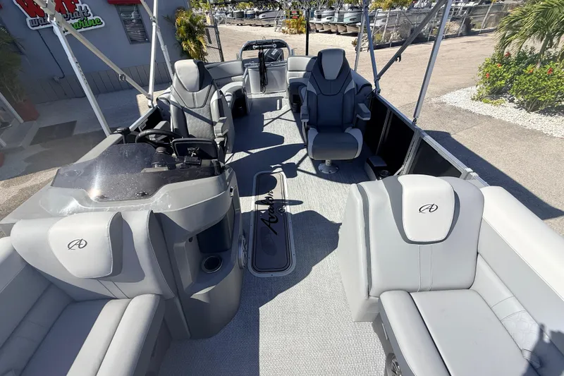 Slide: The Image of 2026 Avalon 2485 LSZ Quad Lounger Tri Toon boat interior with luxurious seating and helm. - 11
