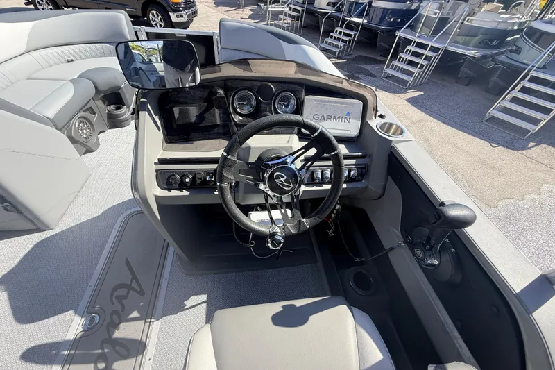 Slide: The Image of Cockpit view of 2026 Avalon 2485 LSZ Quad Lounger, featuring modern controls and Garmin navigation. - 16