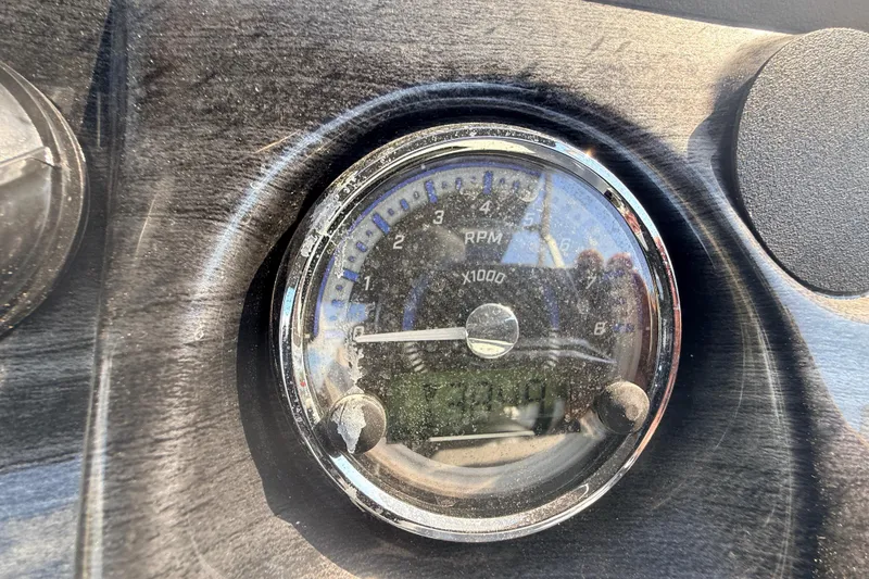 Slide: The Image of Close-up of RPM gauge on 2026 Avalon 2485 LSZ Quad Lounger boat dashboard. - 17